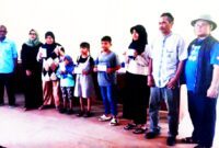 Bingkisan dibagikan di Gedung Serba Guna Desa Palabuan, Kamis 26/03/2025 atau 4 hari sebelum lebaran kepada BPD, LPM, Kader PKK/Posyandu serta RT/RW. Juga 60 anak yatim-piatu. ( Dok.Hariansumedang.com / Abdul Haris )